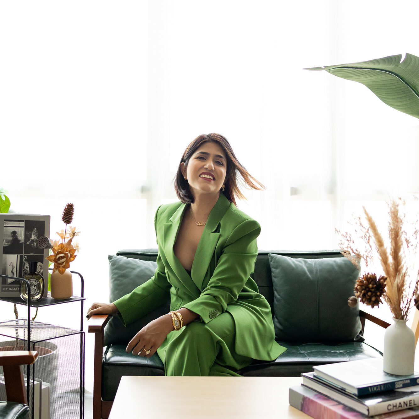 Manasa in a green suit